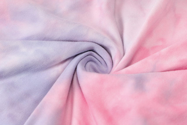 a close up of a pink and black blanket 